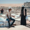 Concern team distribute shelter materials to people affected by the sandstorm that struck Yemen's Al Anad IDP Camp. Photo: Ammar Khalaf/Concern Worldwide