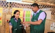 Nutrition Advisor Dawit Hagos showing the nutrition measurement procedure to System Director Hasina Rahman. Bangladesh. Photo; Concern Worldwide