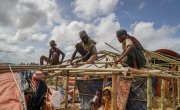 Rohingya men rebuilding their tents before the monsoon arrives, Jamtoli, Ukhiya, Bangladesh.  Photo: Abir Abdullah/Concern Worldwide