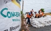 Workers unload supplies from a truck at a Concern distribution centre in Ndeja, Mozambique. Photo: Tommy Trenchard / Concern Worldwide