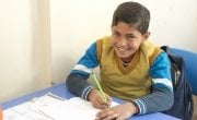 Osama, 12, strengthens his Turkish language skills at a Concern Education Support Centre in Sanliurfa Province, Turkey. Photo: Concern Worldwide. 