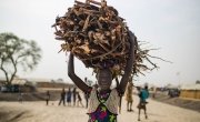 Nyahou, a young IDP living in Bentiu's PoC comes back from gathering firewood outside of the protection of the site. Photo: Steve de Neef