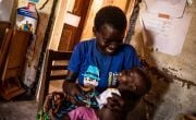 Elaine, 23, feeds her malnourished, 11-month-old-baby Ahadi with therapeutic food in Kiambi DRC