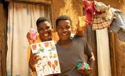 Patricia with her son George, after receiving soap and a Covid-19 information flier. Photo: Concern Worldwide