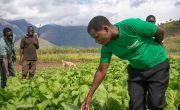 Concern staff member Timothy Kampira advises two farmers in Phalombe, Malawi. Photo: Chris Gagnon/Concern Worldwide