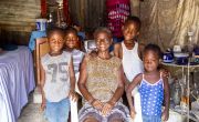 Juliana Tanis, pictured with her grandchildren in her house in Cite Soleil slum, a district of Port-au-Prince, Haiti. Juliana is supported by Concern and recently received a hygiene kit to help prevent the spread of Covid-19.