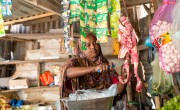 Saabirin* working at her grocery shop. Photo: Mustafa Saeed/Concern Worldwide