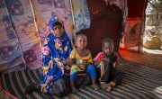 Jamilah* with two of her children outside their hut in an IDP site on outskirts of Mogadishu. Photo: Mustafa Saeed/Concern Worldwide