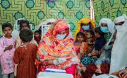 Rubina Baloch (vaccinator) vaccinating a group of women and children. Photo: Ingenius Captures/Concern Worldwide