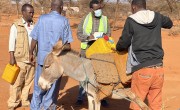 Samira's husband and Concern staff bringing water to their home the morning after Samira delivered a baby girl. Samira, a young Somali mother with seven children, received water from Concern Worldwide in time for the birth of her 7th child. Photo: Concern Worldwide