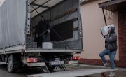 A man loads food kits onto a truck at a community hub in Ukraine