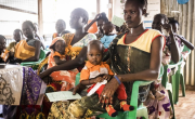 Nyahok Diew waits to be seen at the health care clinic with her 10-month-old daughter, Nyariek. Photo: Ed Ram/Concern Worldwide