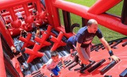 Particpants running up inflatable