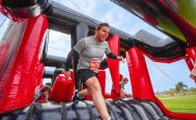 Particpants running through inflatable 