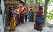 A community volunteer is guiding a group of women on how to purify and manage safe drinking water. She reaches out to the households immediately after an announcement of an impending flood in Sundarganj, Gaibandha. Photo: Saikat Mojumder/Concern Worldwide.