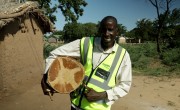 The Chair of the local Emergency Response Committee uses a traditional drum to warn his community in Mbenje when a cyclone is coming, or when the waters of the nearby Shire river start to rise. Photo: Jon Hozier-Byrne/Concern Worldwide.
