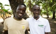 Yussuf Mansaray, VSLA Chair, and Usif Sesay of Concern in Magborkorr, Sierra Leone. Photo: Kieran McConville/Concern Worldwide.