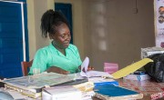 A nurse reviews patient documents at Grandorhum CHC, Pujehun District. Photo: Kago Tshabota.