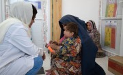 Grandmother Laili (50) attends a health clinic with her granddaughter. Midwife Rabia examines Hafsa. Photo: Nava Jamshidi/Concern Worldwide