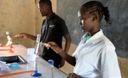 A student heating a test tub in a science class