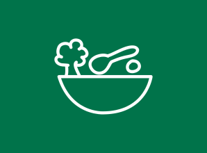 A simple white line illustration of a bowl containing healthy food, including vegetables and a spoon, set against a green background. The icon represents nutrition, food security, healthy diets, and access to nutritious meals.