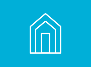 A simple white line illustration of a house against a blue background. The icon represents safe shelter, housing, disaster recovery, and secure living conditions for individuals and families.