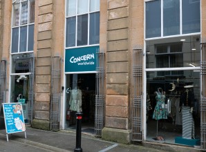 A shop front with Concern Worldwide signage and an A-frame reading Derry's first  pop-up charity shop is now open.