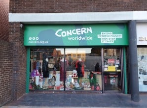 A charity shopfront with Concern Worldwide signage.