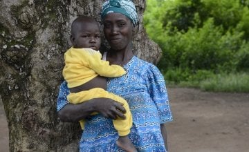 Jabelle Yafiti with her daughter, Aime-Lazara (16 months) who was malnourished but has recovered after receiving treatment at the Concern supported Boudouli Heath Post.  Photo: Chris de Bode