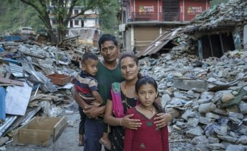 Niv and Shanti Shrestha and their children stand amongst the devastation caused by the earthquake in Dolakha district, Nepal. Photographer: Brian Sokol, 2015, Nepal