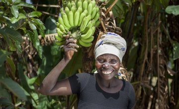 Meresiyana Cimpaye with the Banana Trees she bought from the profits of her Graduation Programme cash transfer, at her home in Bukinanyana, Cibitoke, Burundi. Photo: Abbie Trayler-Smith / Concern Worldwide