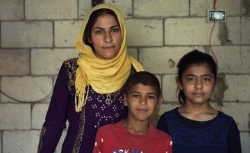 *Kafya (30) , with her children *Azzam, 11, and *Lara, 10, at the home which they live in and which is being refurbished by Concern, in Northern Lebanon. Photo: Mary Turner 