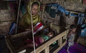 Reshma has a makeshift cot suspended from the ceiling of her temporary shelter to rock Tahira* to sleep and keep her safe. Photo: Abir Abdullah/ Concern Worldwide