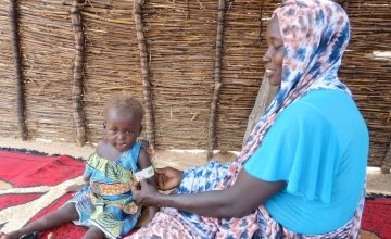 Khamissa, here with her daughter, is a Concern-trained Community Health Volunteer in Doroti, Chad. Photo: Lucy Bloxham