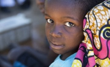 A young girl at a temporary displacement camp in DRC. Photo: Concern Worldwide. 