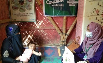 A nutrition counsellor helps a mother and her baby in Cox's Bazar, Bangladesh