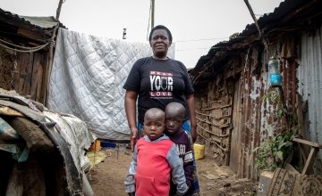 Elizabeth Oduor from Nairobi with two of her young clients from an informal childcare centre in Mathare, Nairobi. Photo: Gavin Douglas 