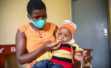 Jane and her son, Mark-Moses at Mukuru Health Centre. Photo: Ed Ram/Concern Worldwide.