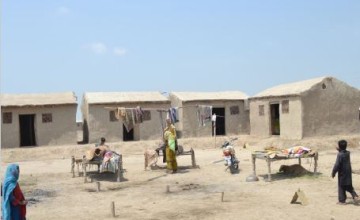 The flood affected beneficiaries in district Sohbat Pur, Balochistan using the transitional shelter provided by RAPID-sub-grantee through USAID-OFDA funding. The shelter was provided in 2014 and is still in use due to periodic mud coating by beneficiaries. Photo: GLOW Consultants / Concern Worldwide.