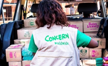 Concern employee Judith Cent distributing soap in Malawi.