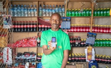 Roble Barkad is a shop owner in Somalia. He accepts cash transfers in his shop. Photo: Gavin Douglas