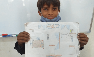 10-year-old Mohamad from Syria draws what he wants to be when he grows up: a doctor.
