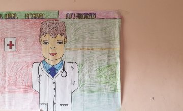 17-year-old Mubarak from Somalia draws what he wants to be when he grows up: a doctor.