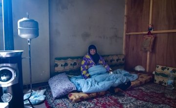 Esma sits in her garage home in Northern Lebanon