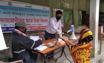  Bangladesh staff are implementing Covid-19 Preventative measures in at all distributions including maintaining social distancing, wearing protective equipment and installing hand washing stations. Photo: Firoz Mahmud / Concern Worldwide.
