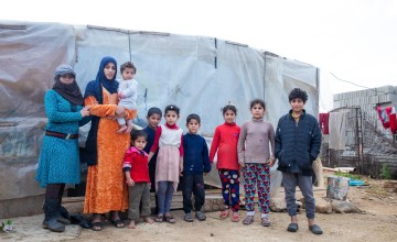 Ghazal* with her children and extended family. Photo: Gavin Douglas