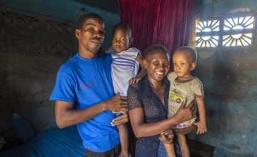 Rosette holds her son John Kelly, with husband Pierre and son Isaac. Photo: Dieu Nalio Chery / Concern Worldwide / Haiti (2021)