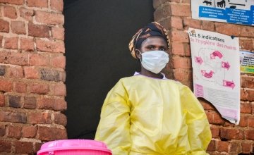 Lwanzo, a health worker from Lukanga, dresses to set an example of what to wear to isolate an infectious disease patient.  Photo: Esdras Tsongo/Concern Worldwide