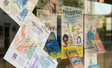 WaveofHope posters line Concern's bookshop window in Holywood, decorated by local primary school pupils. I