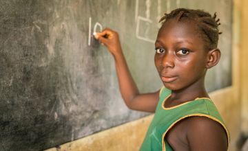 10-year-old Sally in class at a primary school in Sierra Leone. Photo: Michael Duff